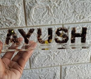 Resin Name stand hat elevates any setting with its glossy finish and refined detailing. Ideal for events, desks, or as a thoughtful personalized gift..