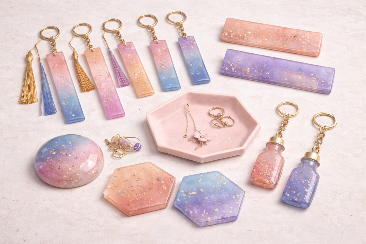Handcrafted resin bookmarks, keychains, nameplates, trinket trays, paperweights, and coasters arranged on a neutral surface, showcasing real handmade textures and soft pastel tones.